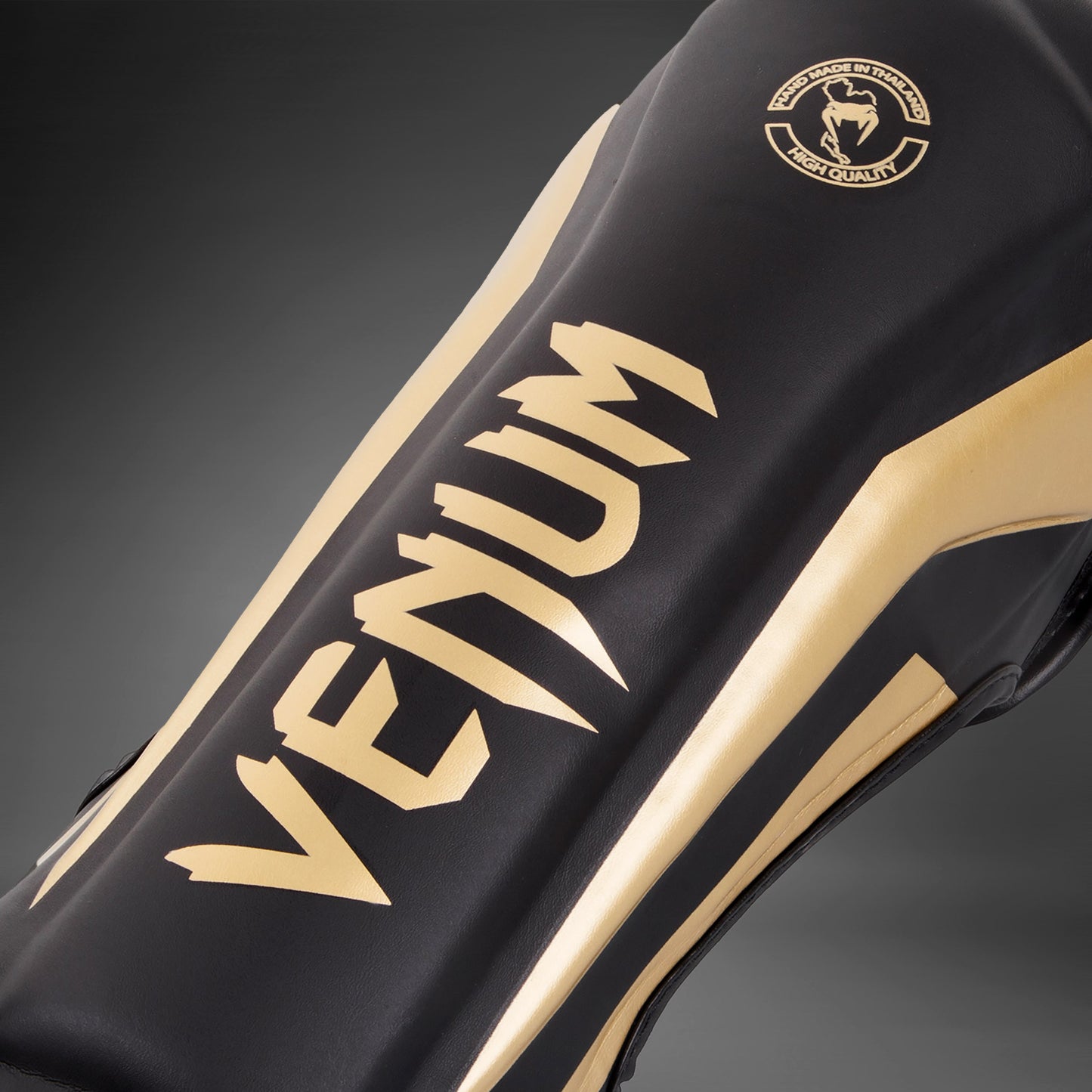 Venum Elite Standup Scheenbeschermers - zwart/goud