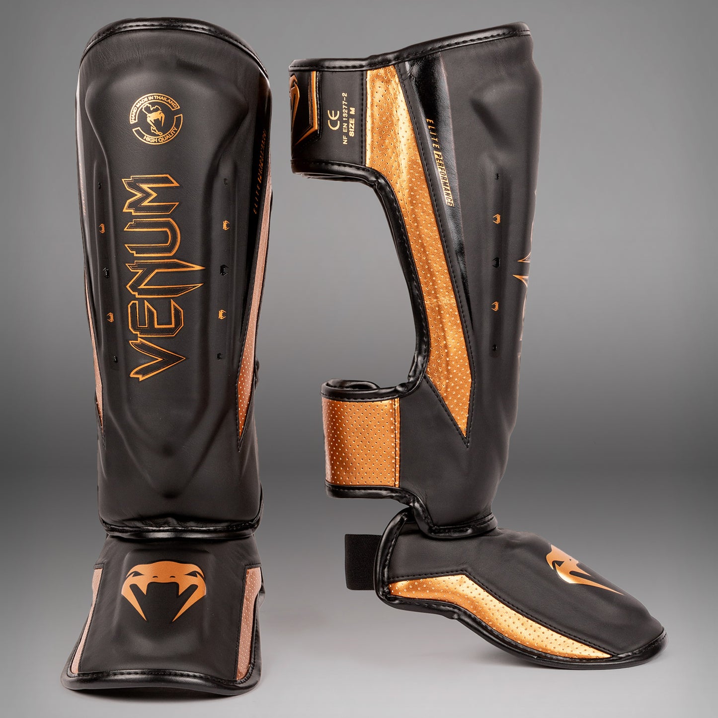 Venum Elite Evo scheenbeschermers - Zwart/Brons