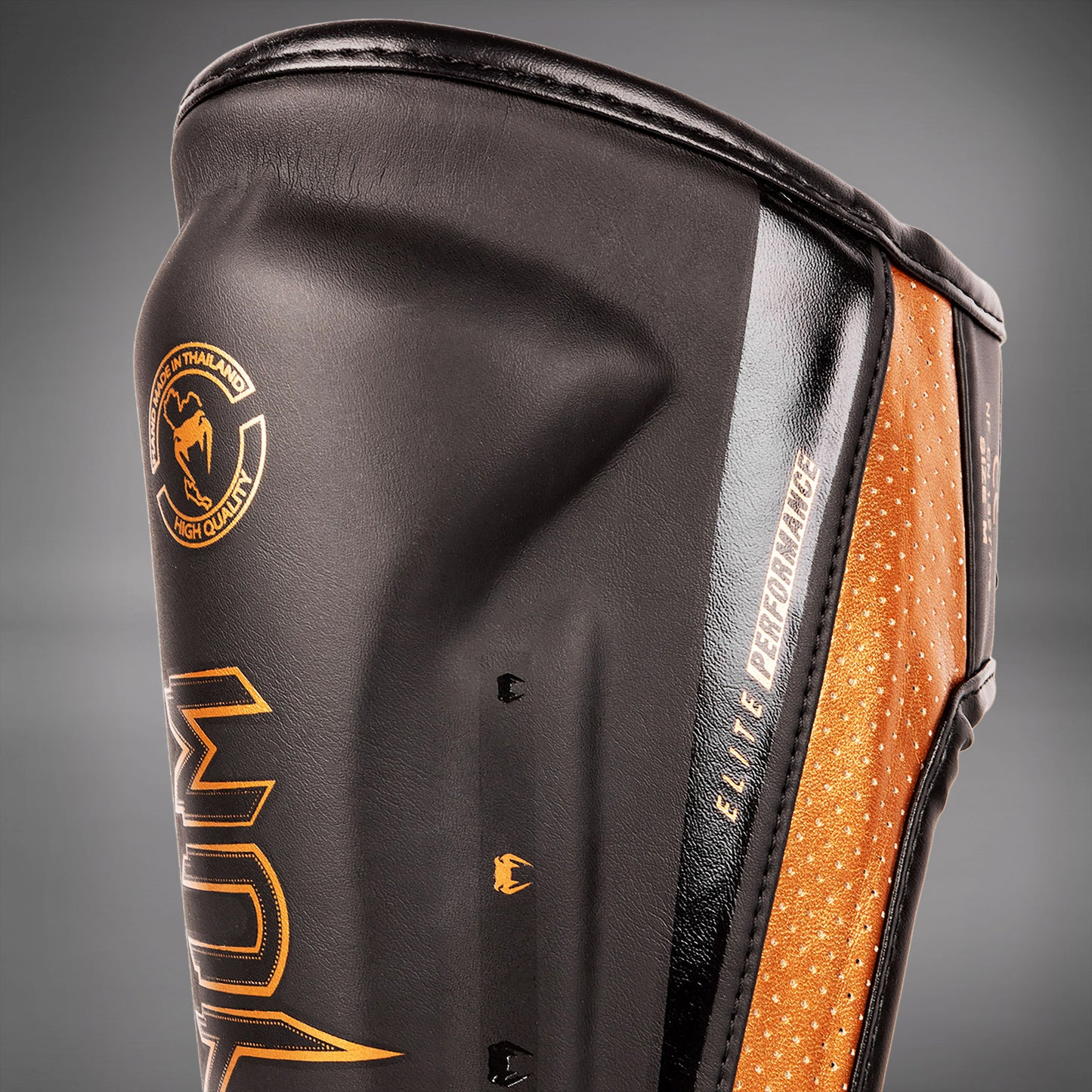 Venum Elite Evo scheenbeschermers - Zwart/Brons