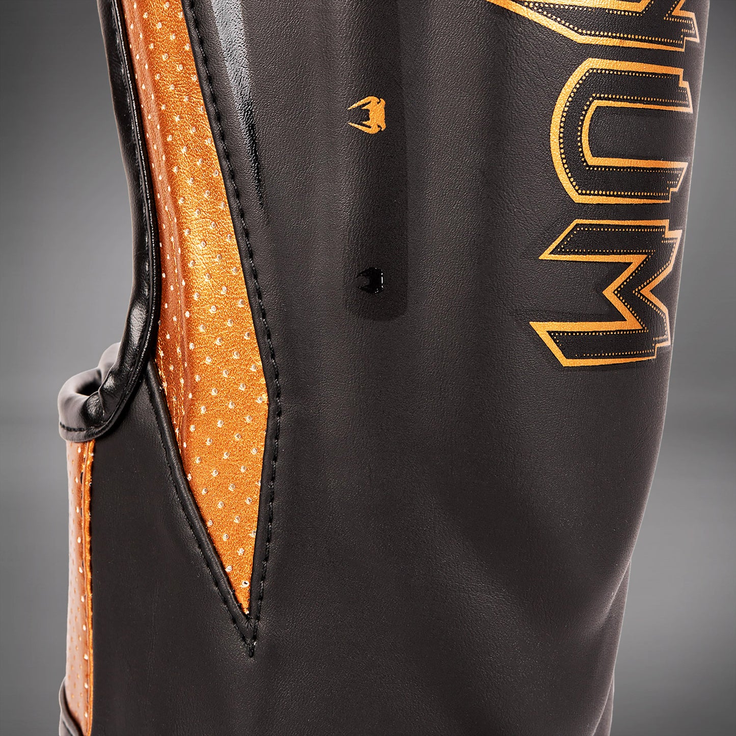 Venum Elite Evo scheenbeschermers - Zwart/Brons