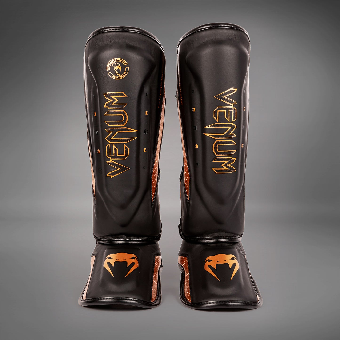 Venum Elite Evo scheenbeschermers - Zwart/Brons
