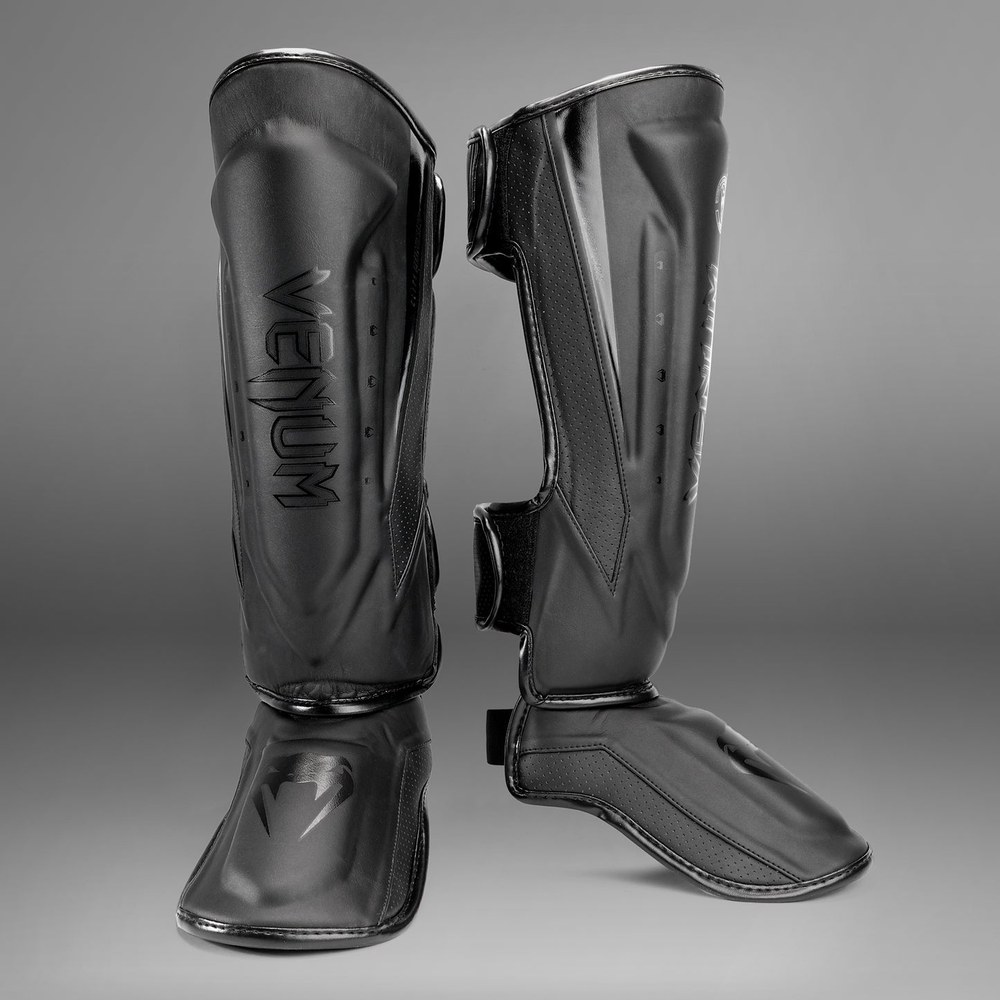 Venum Elite Evo scheenbeschermers - Zwart/Zwart