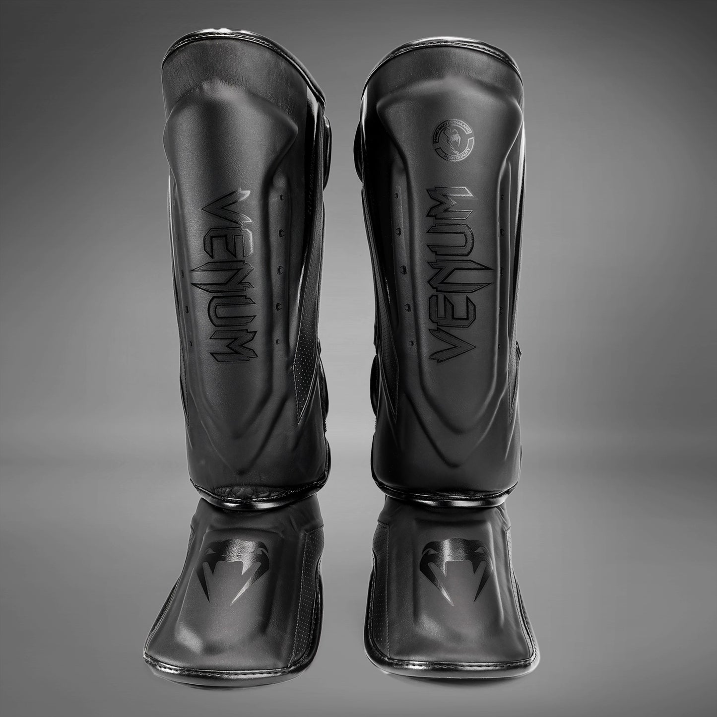 Venum Elite Evo scheenbeschermers - Zwart/Zwart