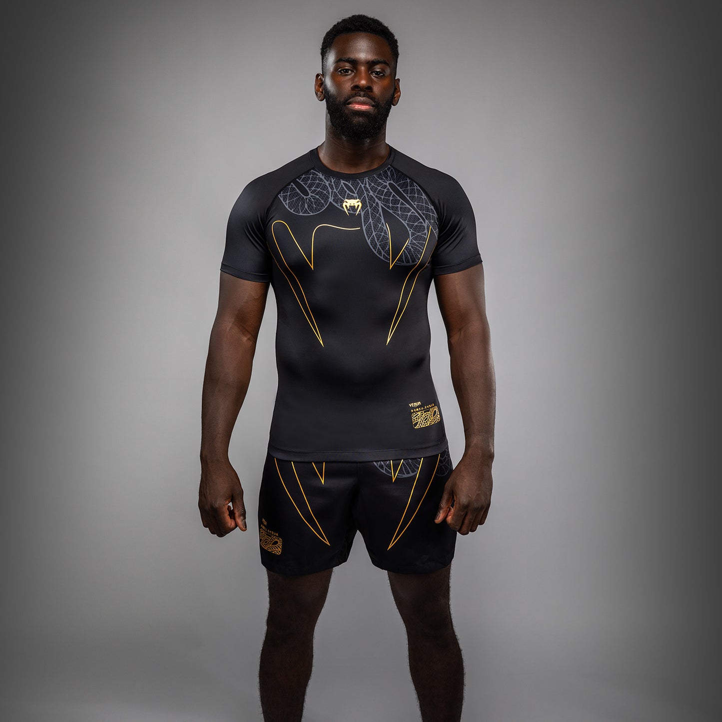 Venum Serpenti Rashguard met korte mouwen – Zwart/Zilver/Goud