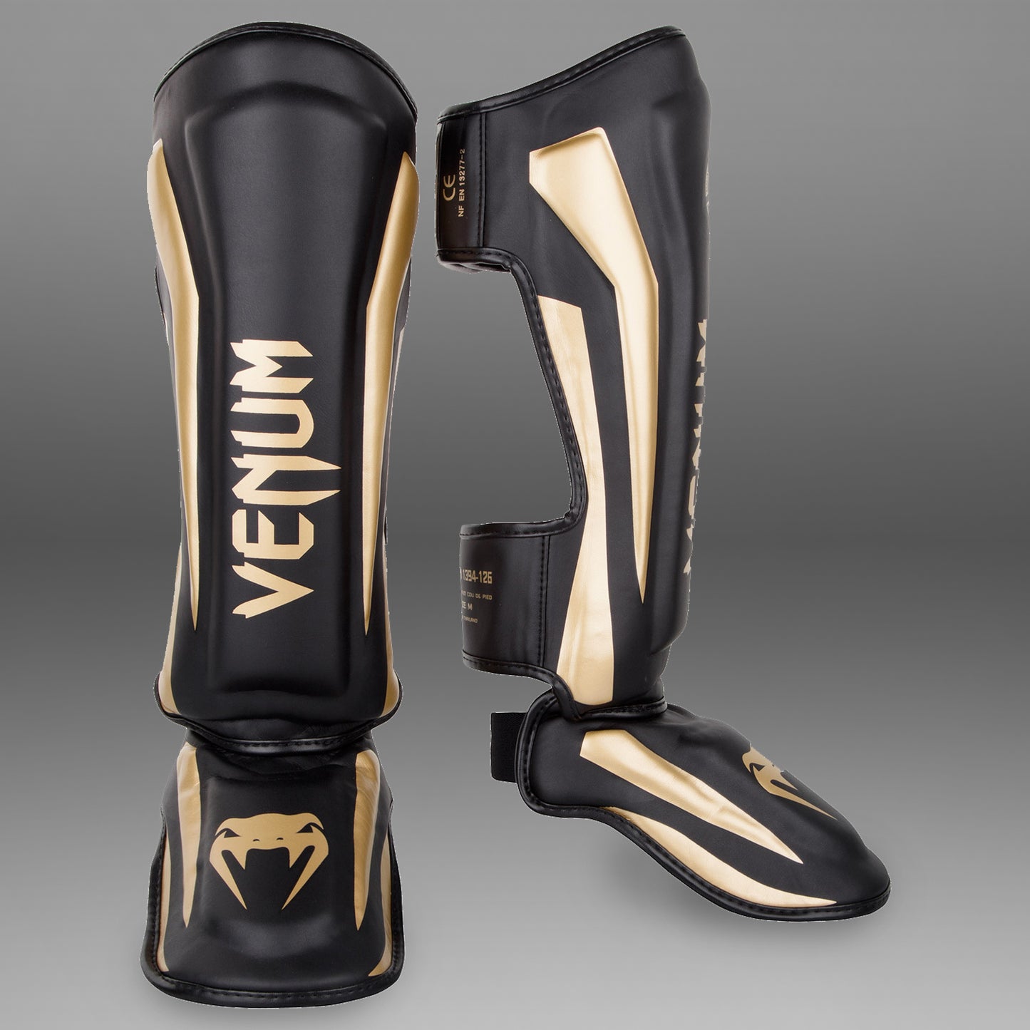 Venum Elite Standup Scheenbeschermers - zwart/goud